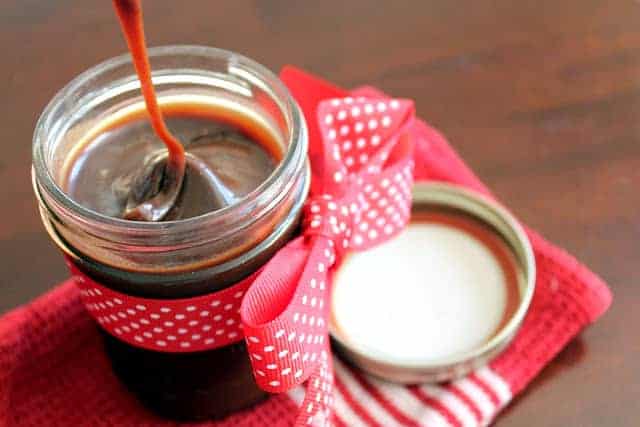 This decadent caramel nutella sauce is a sweet mix of hazelnut, chocolate, and caramel. It's the perfect dessert topping!