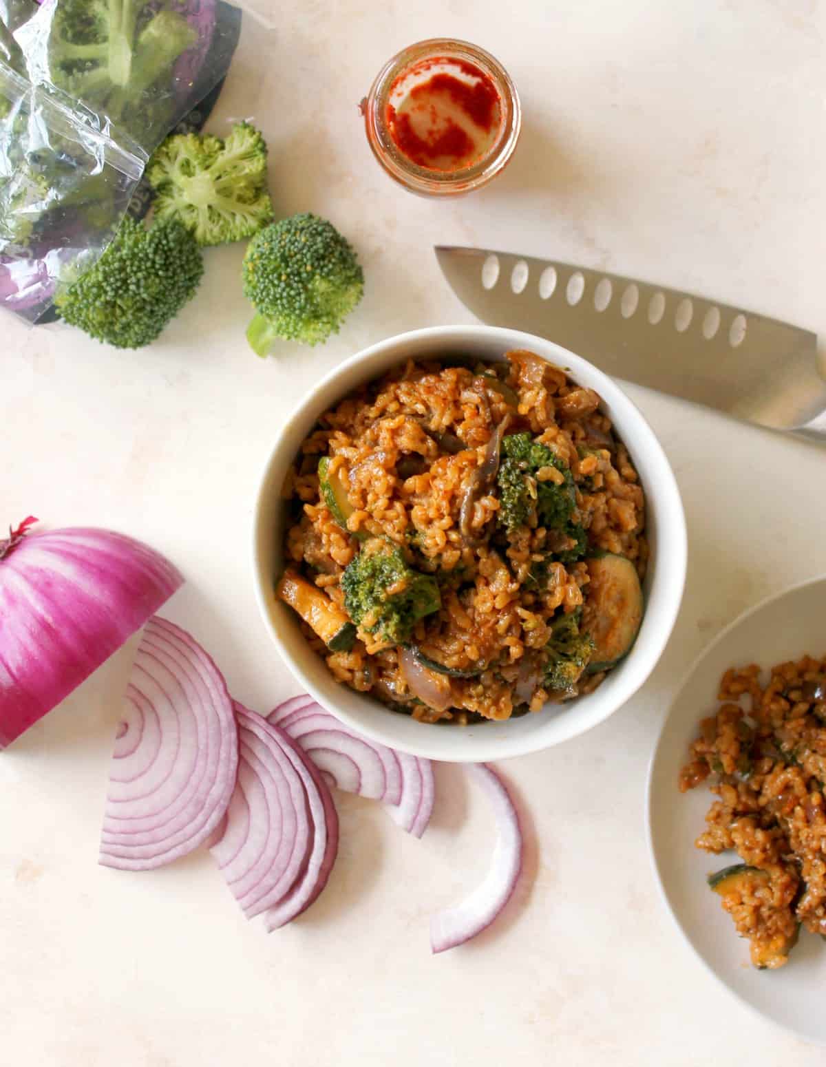 Coconut Red Curry Fried Rice is the weeknight dinner you need in your cooking repertoire! Just 7 convenient ingredients make up this filling, one-pan meal!