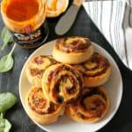 Cheesy Tomato, Basil & Spinach Pinwheels. These 5 ingredient appetizers will be star of your next party! So easy to make and bursting with flavor!
