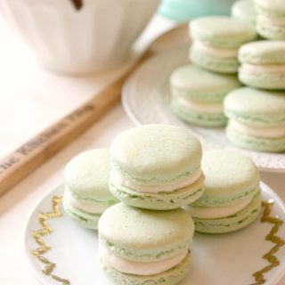 Irish Cream & Milk Chocolate French Macarons! Irish Cream Buttercream and gooey center of rich, milk chocolate ganache are sandwiched by classic macaron shells. Sweet and dainty, these airy little cookies make a perfect dessert for a special occasion.