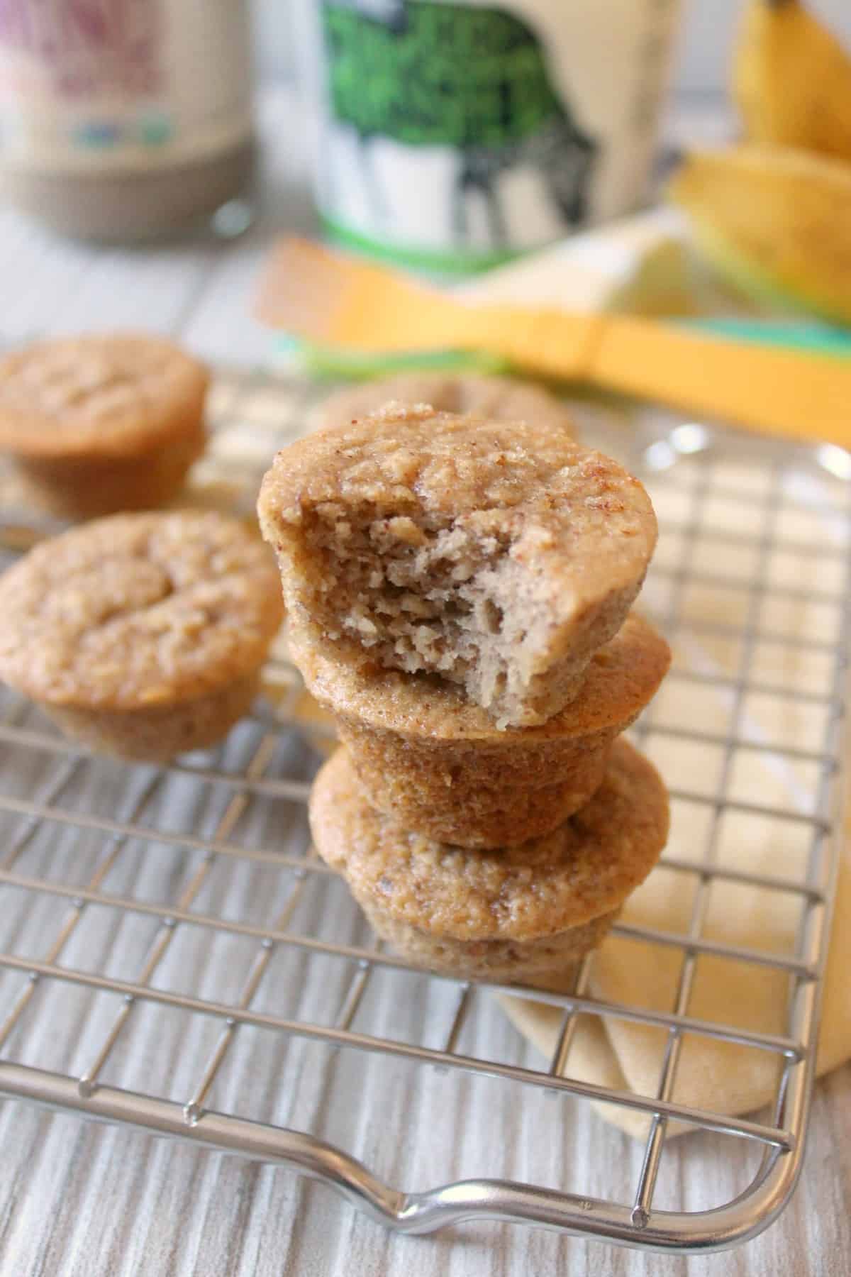 Banana Oat Mini Muffins are an easy snack made entirely in the food processor! Made with oat flour, almond butter & yogurt and sweetened with ripe banana and honey for wholesome munching any time. 