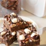These gooey Mississippi Mud Bars are full of chocolate flavor and loads of texture thanks to a heaping helping of marshmallow, pecans and coconut flakes drowned in fudgy topping. It's one muddy mess you'll never mind having in your kitchen!