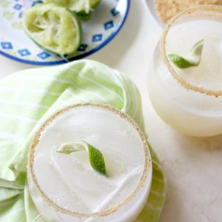 Coconut Key Lime Pie Coolers! The combination of tart lime juice and creamy coconut milk will make you reach for another sip of this tasty drink and remind you of sweet and smooth key lime pie with an extra tropical twist. Rim the glass with crushed graham crackers to drive the flavor home!