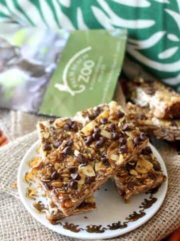 There's no "monkey business" in these Monkey Bars; nutritious Banana Peanut Butter Chocolate Chip Granola Bars that make a perfectly portable snack! Made with oats, ground flax, chia seeds, peanut butter and banana chips {plus few tablespoons of mini chocolate chips, if you wish} these wholesome granola bars are the ultimate "fun fuel."