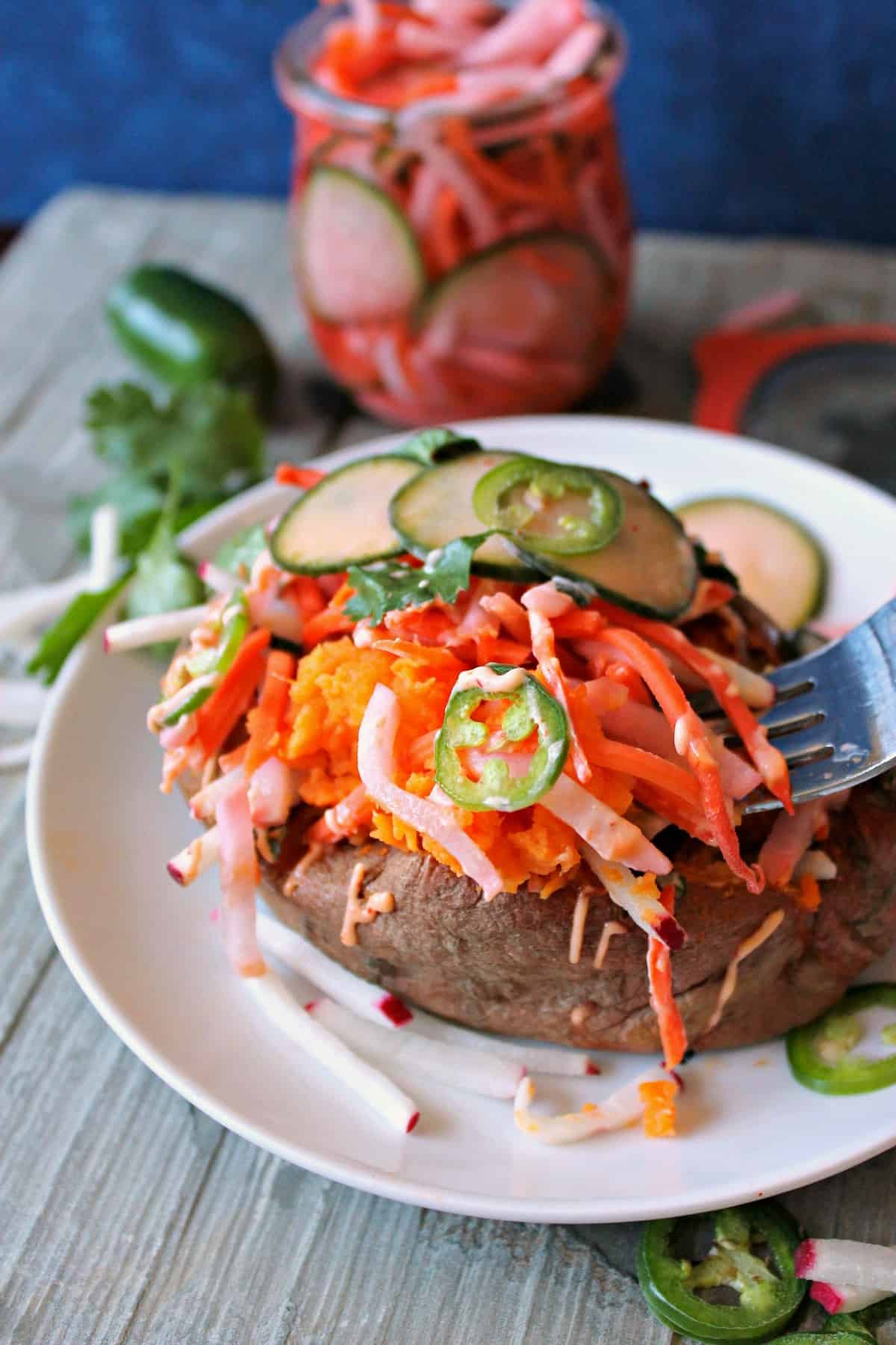 Banh Mi Loaded Sweet Potatoes make a nutritious meal that's anything but ordinary. Boasting some of the flavors of a classic Vietnamese Banh Mi Sandwich, this loaded spud covers all the bases: Sweet, salty, spicy, creamy and crunchy!