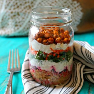 Savory Yogurt Parfaits! Whether you're on the go or simply need a moment to savor a nutritious bite, this layered snack will hit the spot. Quinoa, beets, kale and carrots are divided by a cool, creamy yogurt and cucumber sauce and topped off with flavorful roasted chickpeas for some crunch!