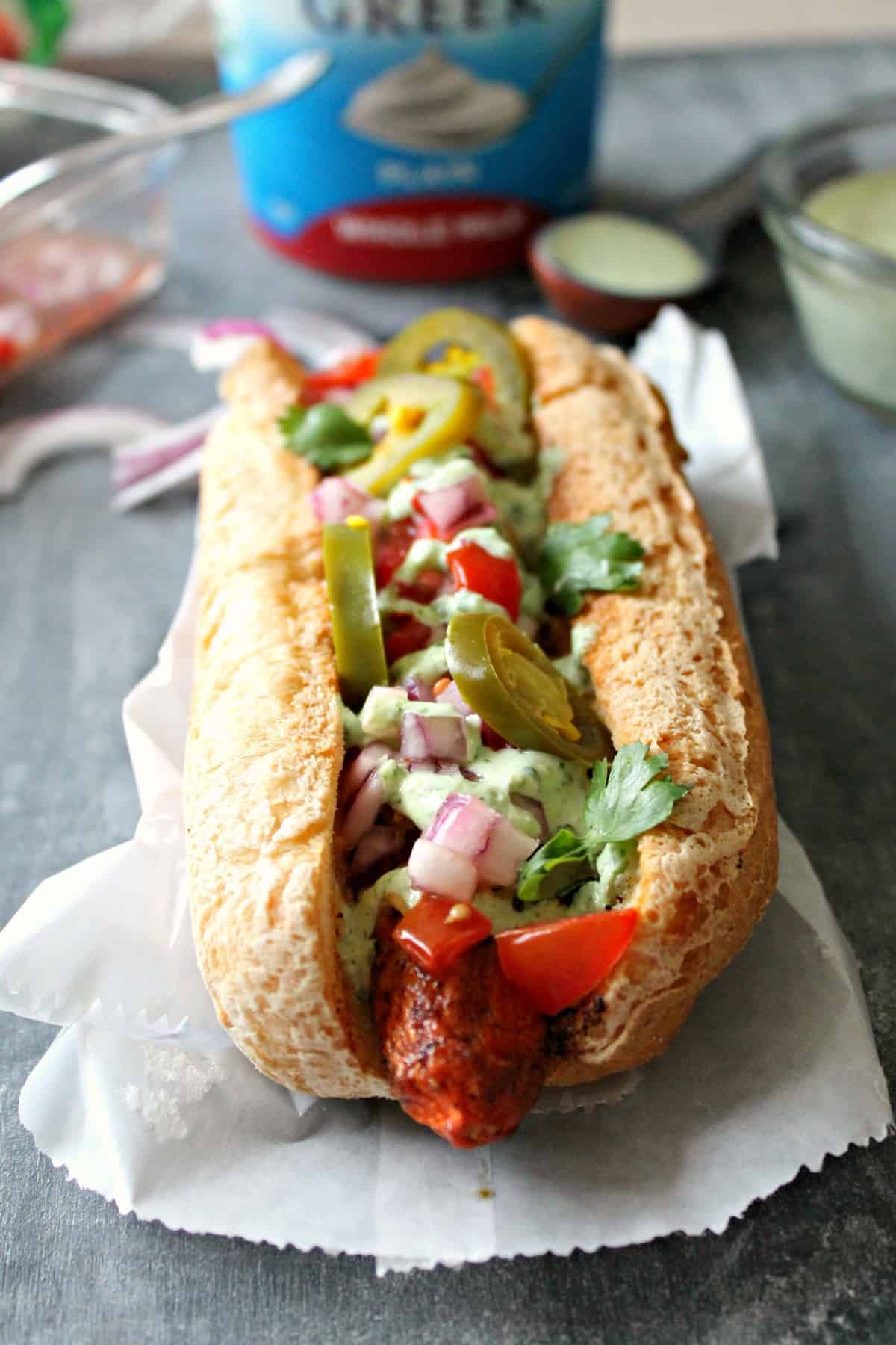 Tex-Mex "Carrot Dogs" with Cilantro Garlic Yogurt Sauce. A meatless version of a summer favorite: Smoky carrot "hot dogs" loaded with Tex-Mex toppings!