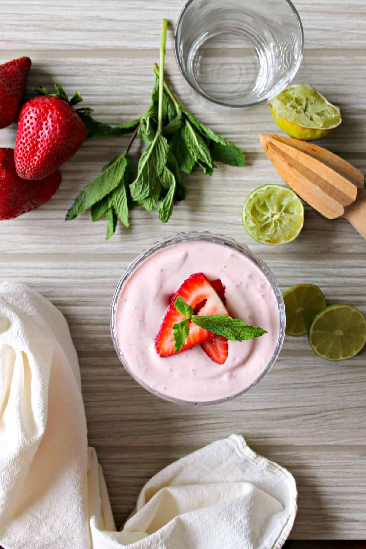 Skinny Strawberry Mojito Fruit Dip! Stay bikini-ready while you enjoy this light & luscious fruit dip that has the flavors of a fresh summer cocktail!