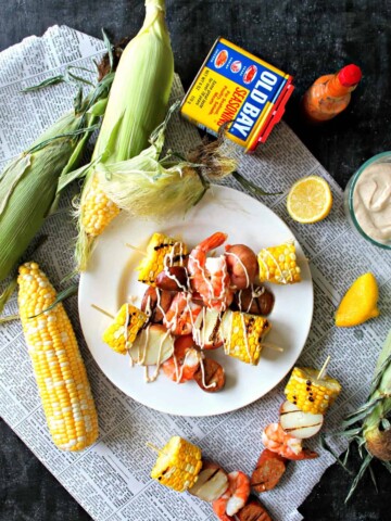 Shrimp Boil Kabobs with Old Bay Aioli -- summer on a stick! Yes, shrimp boils are traditionally casual & messy, but this skewered version adds a touch of sophistication that makes it a fantastic addition to even elegant summer gatherings.