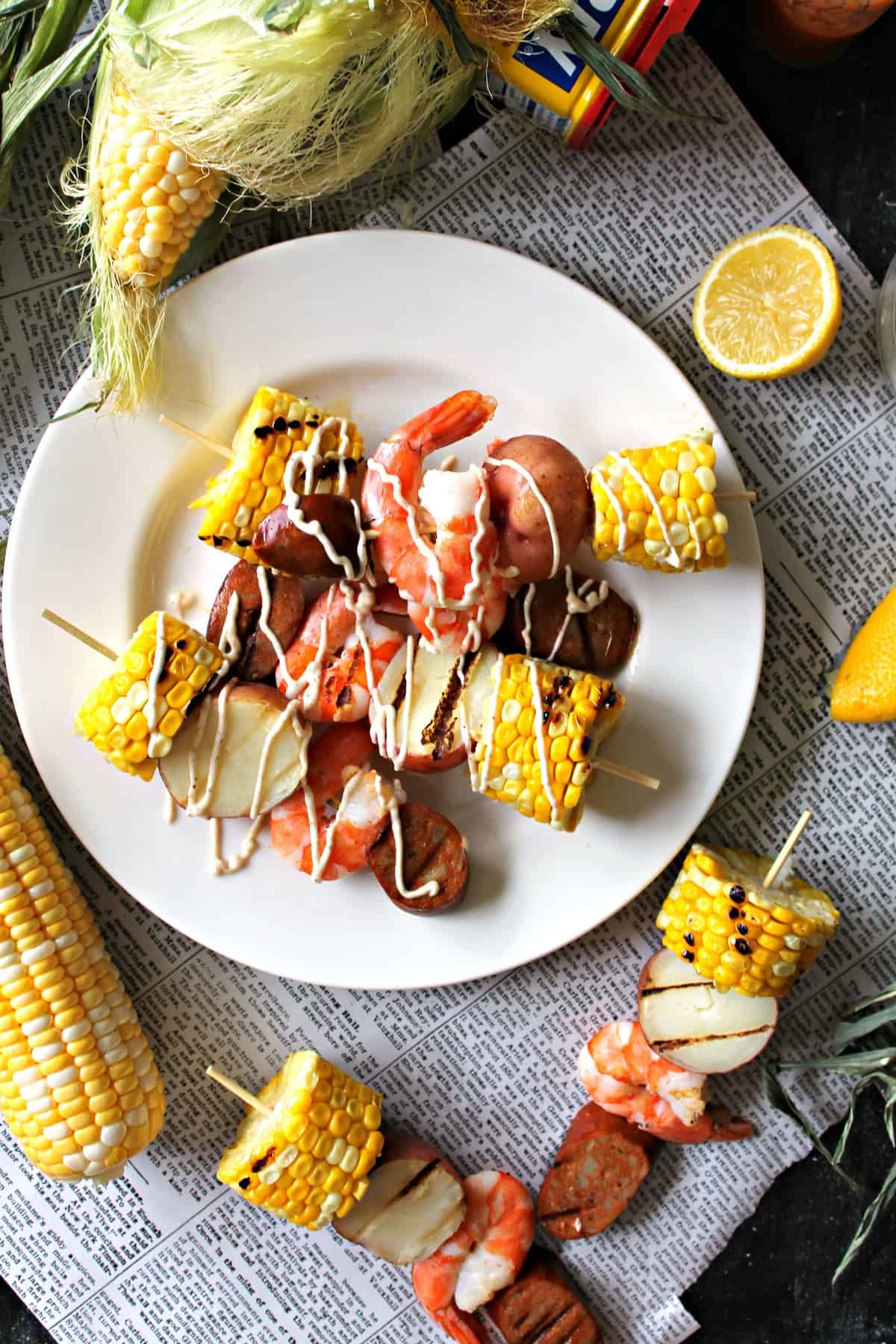 Shrimp, sausage, corn and potatoes make these Shrimp Boil Kabobs drizzled with a homemade Old Bay aioli a perfect summer meal