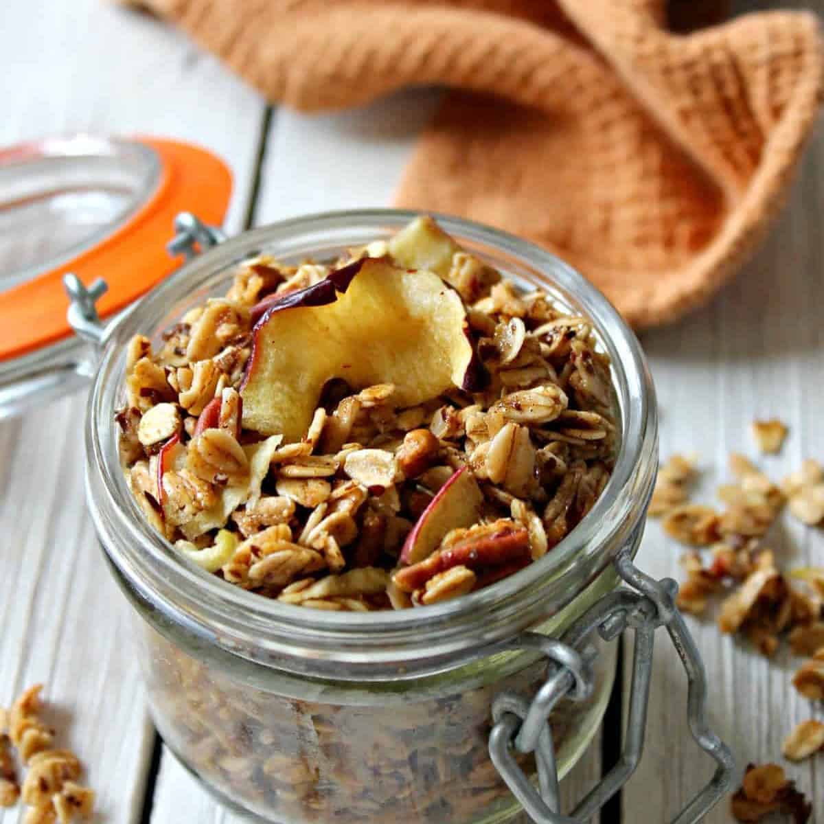 Spiced Apple Granola in a glass jar.
