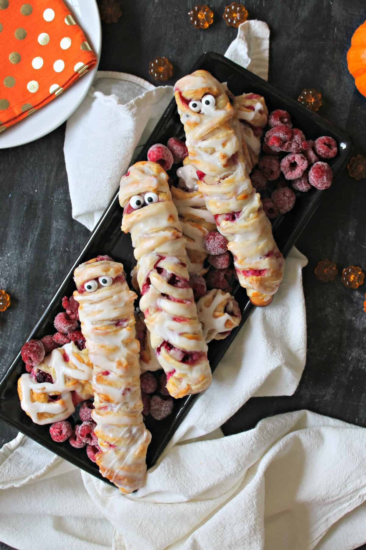 Berry & Cheese Danish Mummies are the perfectly sweet and spooky way to start off your Halloween! Store bought puff pastry makes these a cinch to create!