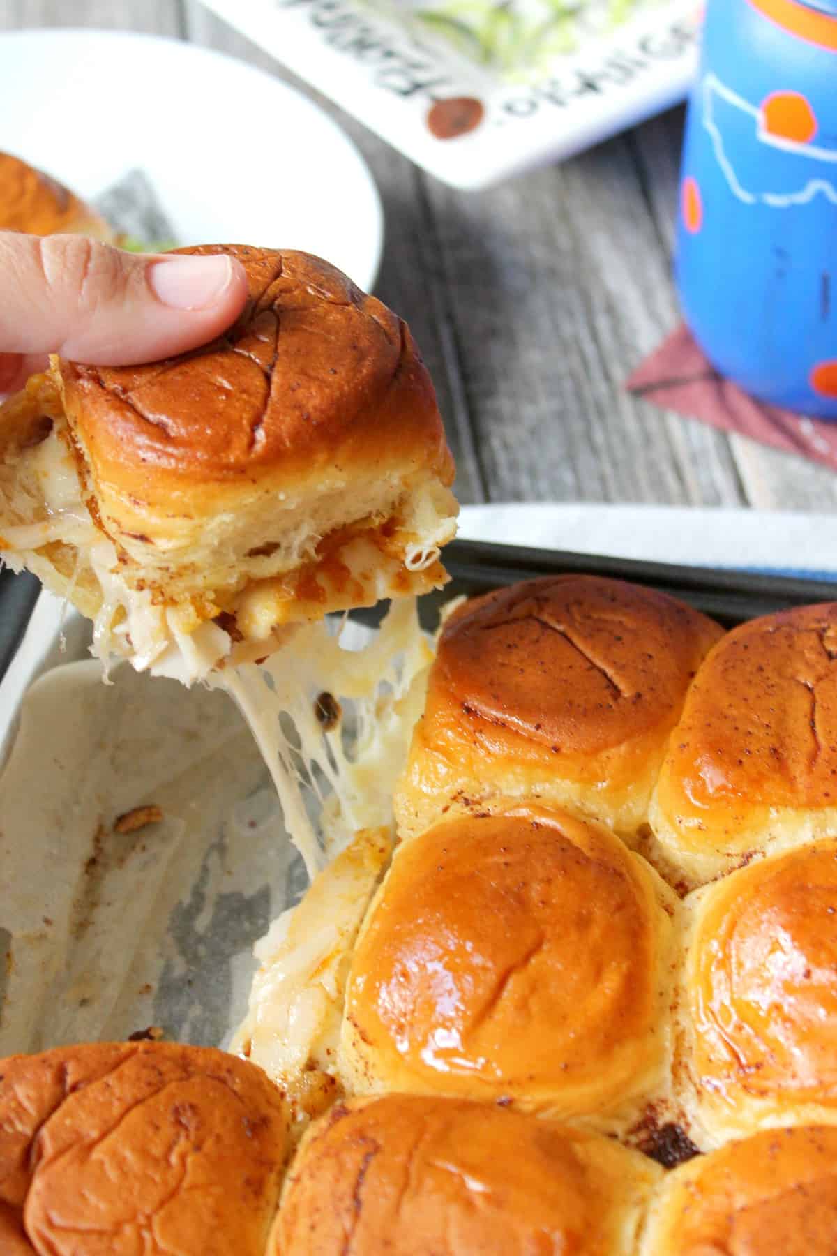 Baked Pumpkin Butter Turkey & Cheese Sliders. The ultimate bite of fall flavors: Pumpkin butter, turkey, pecans & melted cheese baked to buttery perfection!