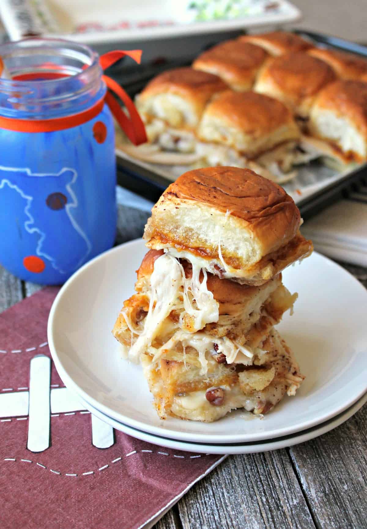 Baked Pumpkin Butter Turkey & Cheese Sliders. The ultimate bite of fall flavors: Pumpkin butter, turkey, pecans & melted cheese baked to buttery perfection!