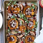 Spiced acorn squash, pears and quinoa cook simultaneously in the oven before being tossed with dried cranberries, pecans, goat cheese, and fresh arugula.