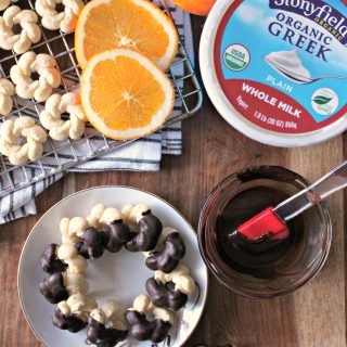 Chocolate-Orange Yogurt Spritz Cookies. Dainty and delicate, these orange-scented cookies are a spin on a classic spritz cookie with the addition of yogurt and a dip in rich dark chocolate.