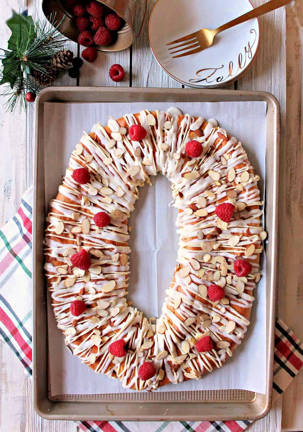 Raspberry White Chocolate Almond Kringle! Beautiful pastry studded with fresh raspberries, sweet drizzle & crunchy almonds. A perfect holiday breakfast.