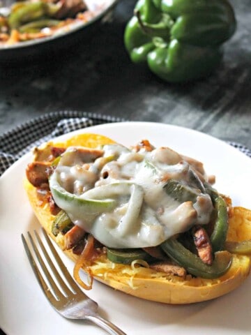 Easy Chicken Philly Spaghetti Squash Boats. Overflowing with sauteed peppers and onions, seasoned strips of chicken and melty cheese, these boats will become a popular request for a weekday meal!