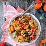 Tangerine Shrimp & Vegetable Stir Fry! Sweet red peppers, savory scallions and zesty tangerine add a burst of flavor to this easy shrimp stir fry dish. Serve over hot rice for a satisfying meal.