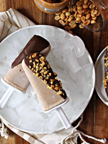 Chocolate Peanut Butter Frozen Yogurt Pops! These easy-to-make pops are a great way to get some healthy goodness into the after school snack rotation! Made with wholesome ingredients {and even some hidden fruits and veggies thanks to a special secret ingredient}, they'll be a treat you won't mind serving up.