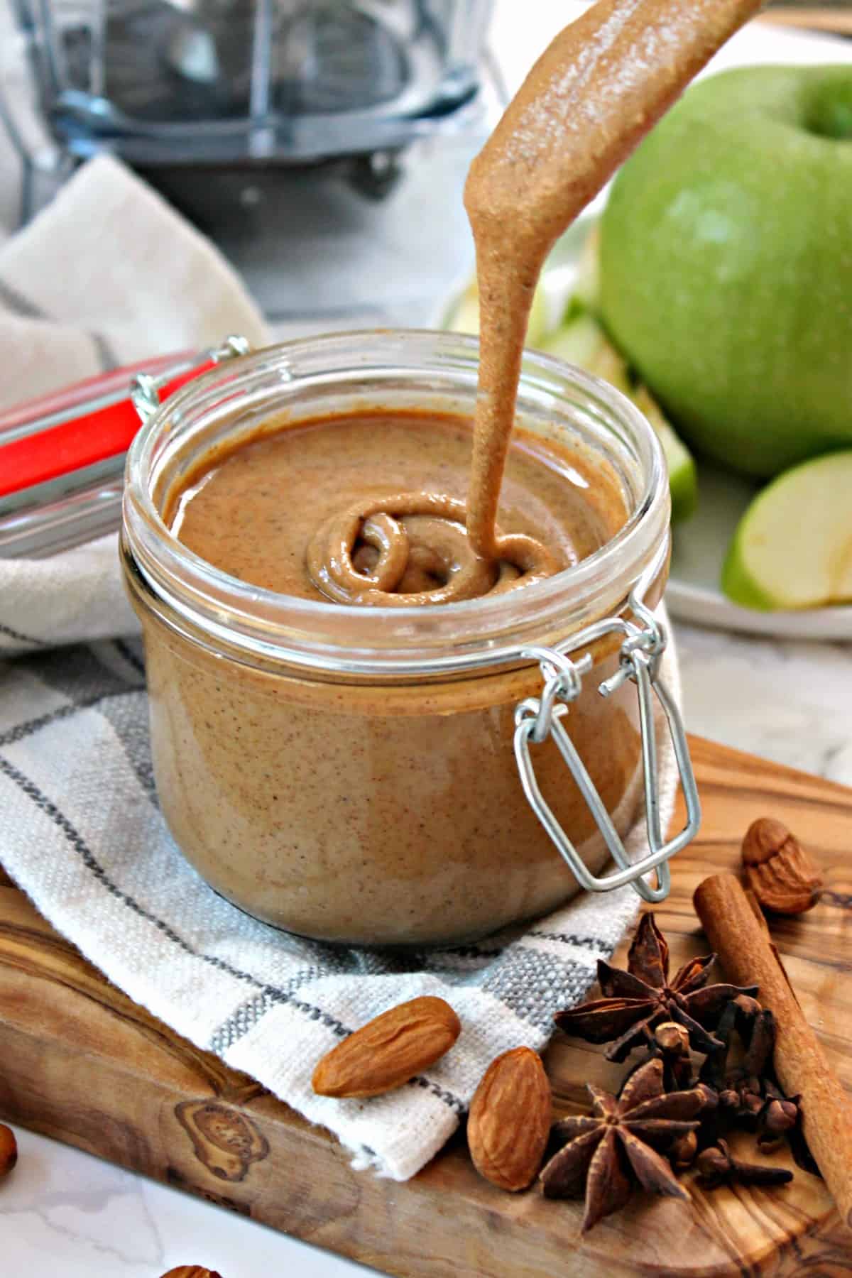 Vanilla Chai Almond Butter! This creamy blend of almonds, tantalizing spices & sweet vanilla is totally addictive... and it's made in just minutes using your high speed blender! This nut butter recipe can be customized using your favorite nut and is pure perfection slathered on toast, muffins or fruit!