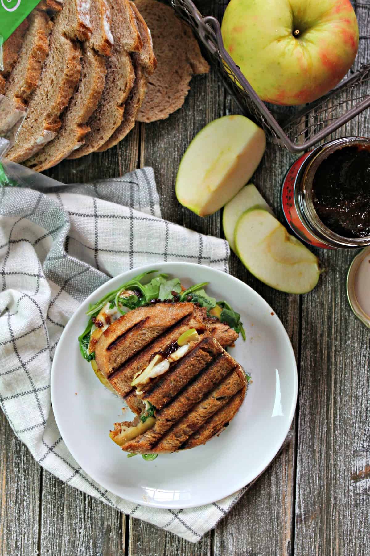 Manchego, Fig & Apple Panini! Even quick and easy lunches can be seasonal and flavorful; the proof is in this panini! Crusty bread is slathered with fig preserves, then topped with manchego cheese & tart apple slices and grilled to melty perfection!