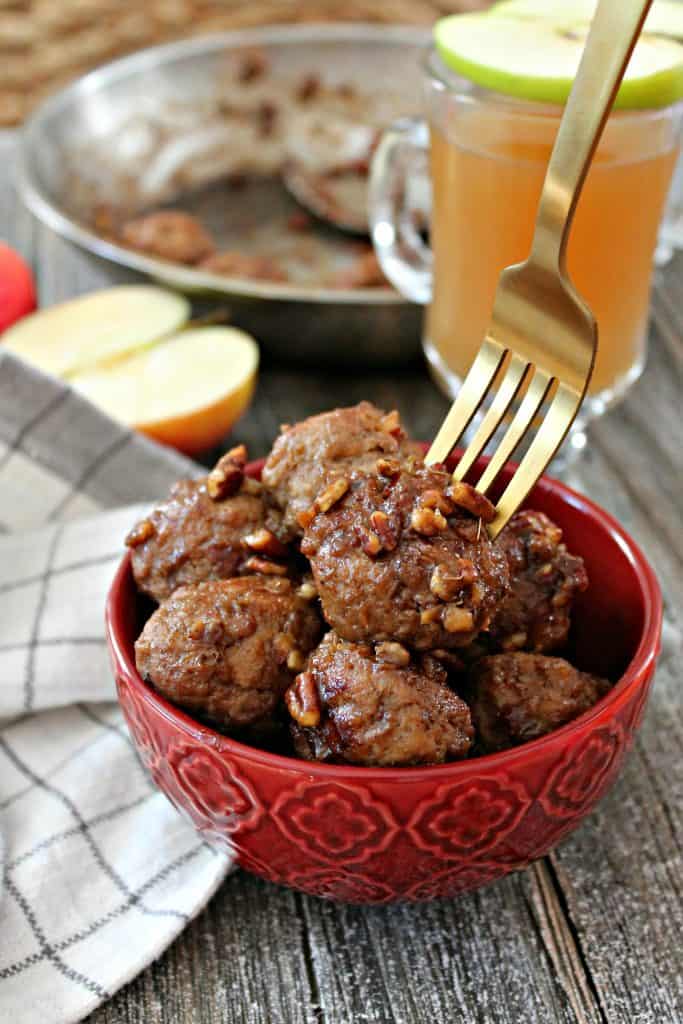 Cider Glazed Turkey Apple Meatballs! Shredded apple keeps these easy meatballs juicy & flavorful. Tossed in a sweet cider glaze, they make a great fall party appetizer or accompaniment to rice or quinoa for a quick dinner.
