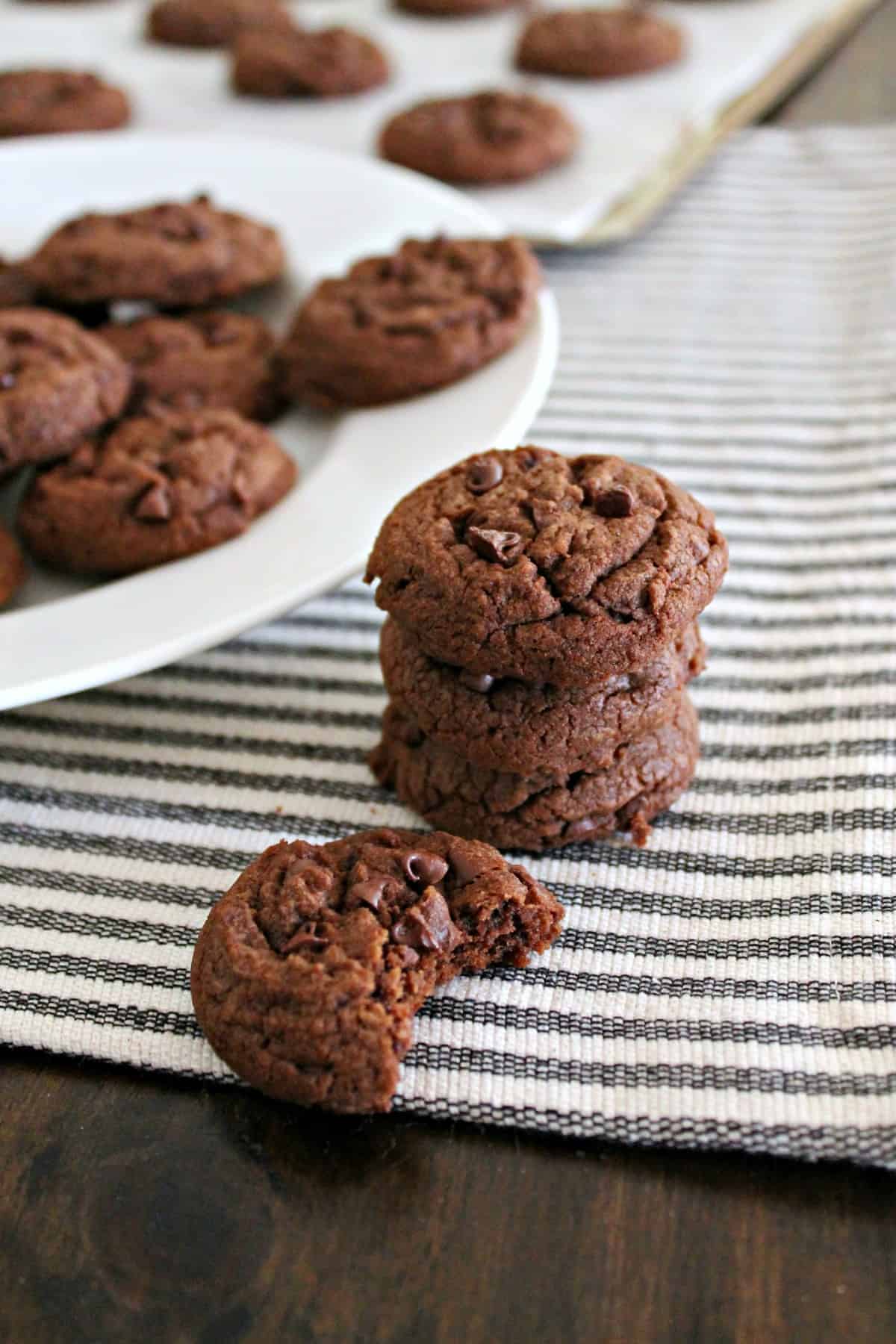 Chocolate Chocolate Chip Cookies! These cookies are a deep, chocolaty, mini-chip-studded version of my favorite chewy chocolate chip cookie recipe! Made with melted butter and requiring no chilling time, they're an easy recipe to whip up for last minute gatherings or any celebration! 
