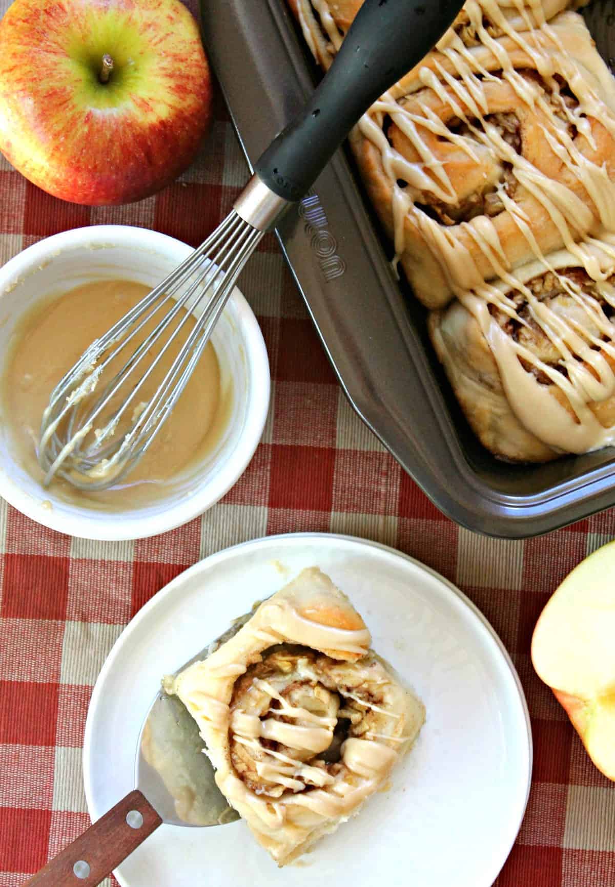 Soft and gooey caramel apple cinnamon rolls are topped with a homemade vanilla glaze and packed with sweet apples and pecans