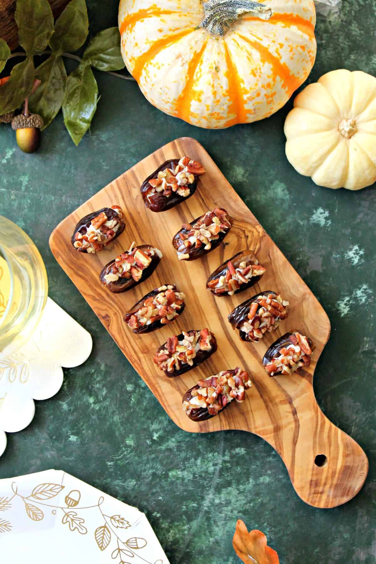 Honey-Cinnamon Cream Cheese Stuffed Dates! Sweet, sticky dates are stuffed full of honey-sweetened, cinnamon-spiced cream cheese, then rolled in crunchy roasted pecans. A perfect snack or appetizer to prepare last minute holiday entertaining! 