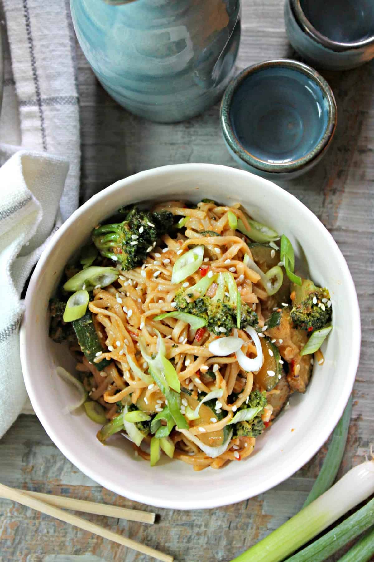 Easy Spicy Peanut Noodles! Need a quick weeknight meal that pleases the masses? This easy peanut noodle recipe comes together in minutes and is a great way to clean out odds and ends in the refrigerator, to boot! 