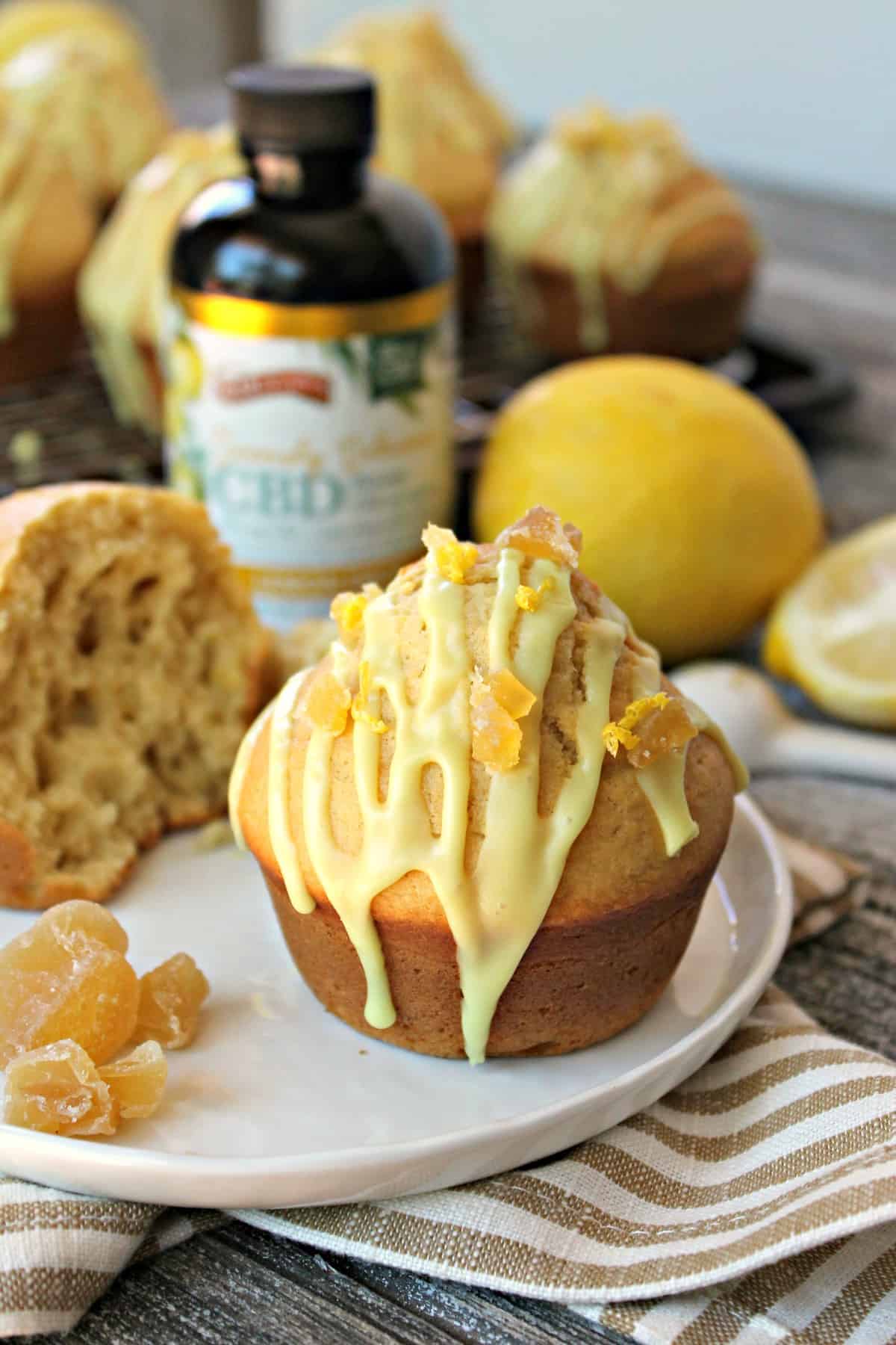 Glazed Lemon-Ginger Muffins! A perfect way to begin the day, these bright and cheerful lemon muffins are amplified by the addition of fragrant ground ginger. A sweet glaze drizzled over top and a sprinkling of candied ginger gives them a delicious finishing touch! 