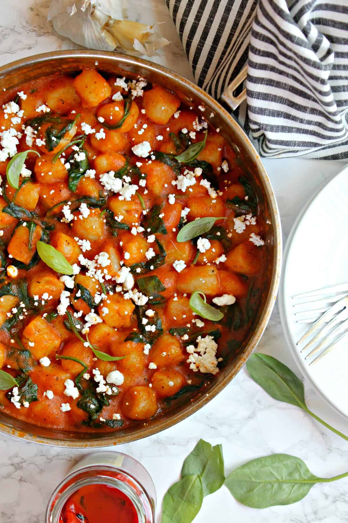 Easy Skillet Gnocchi in Roasted Red Pepper Sauce with Spinach & Goat Cheese! Busy weeknights are no reason to settle for subpar meals! Using just a handful of items from Trader Joe's {substitutions included for those of you without TJ's}, you can make this satisfying comfort food dish! 