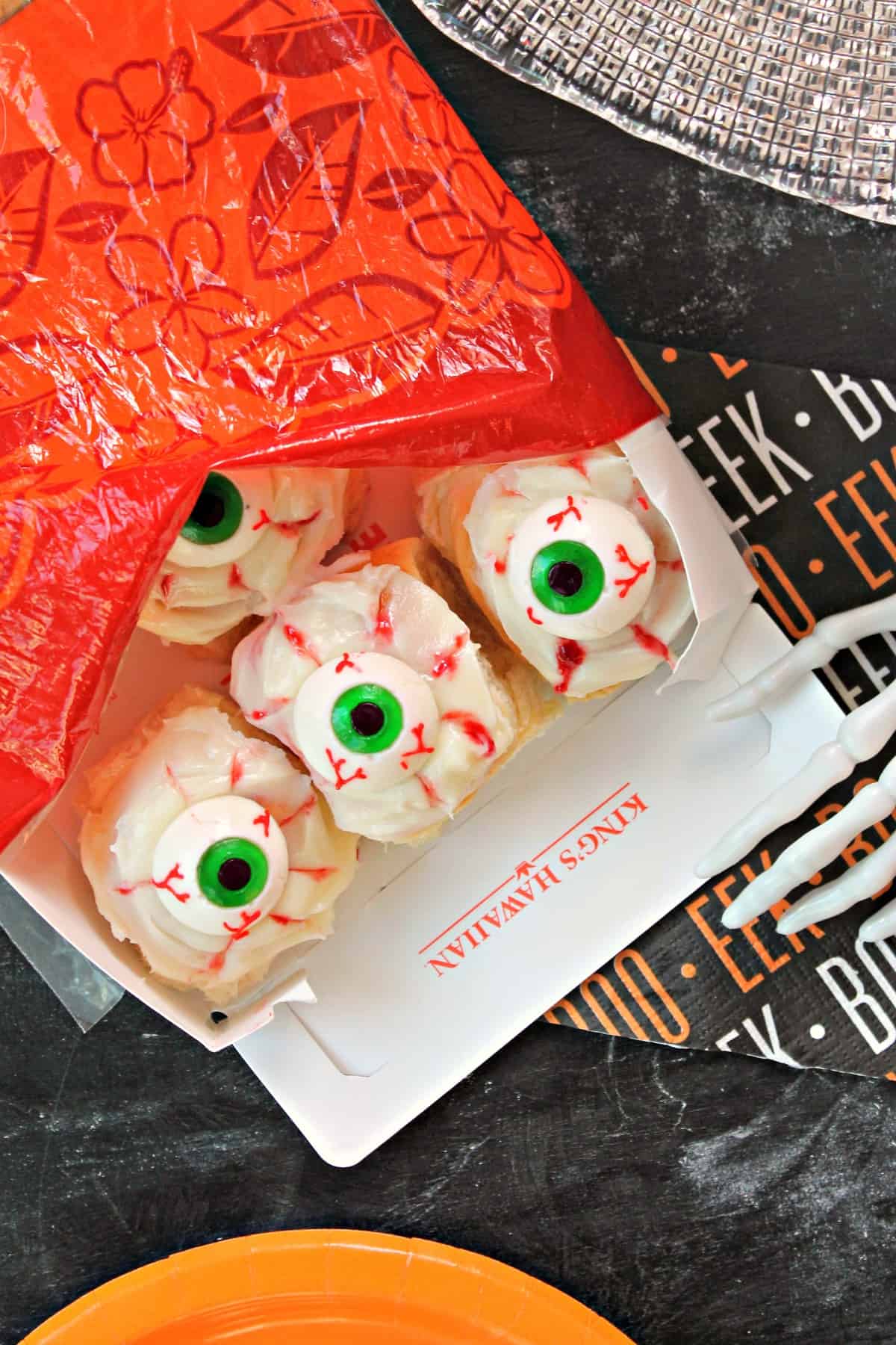 Spooky Eyeball Sweet Rolls! Need something quick and easy to make for Halloween festivities? These ooey, gooey, no-bake sweet rolls come together quickly with the help of King's Hawaiian Dinner Rolls! Filled with raspberry jam and topped with a creamy glaze and gummy eyeballs, they'll become your family's favorite creepy treat! 