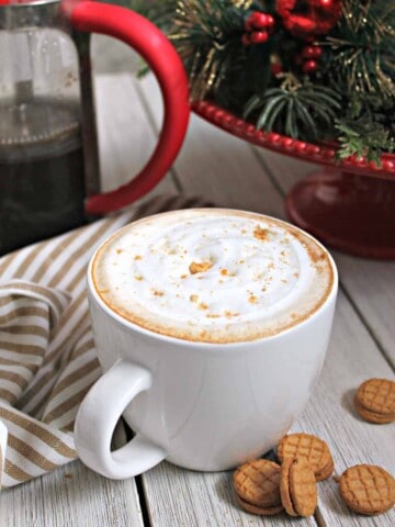 Fluffernutter Latte! This sweet, creamy homemade latte is perfect for enjoying when the temperatures drop. Made with a simple peanut butter syrup and topped off with a swirl of marshmallow fluff, you'll find yourself skipping the coffee shops and making this unique beverage at home. 