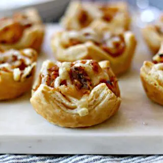 Close up shot of Sausage Reuben Puffs.