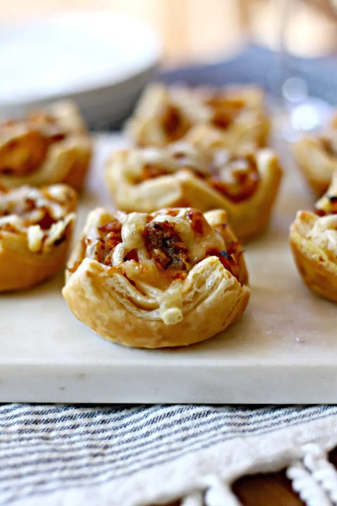 Close up shot of Sausage Reuben Puffs.