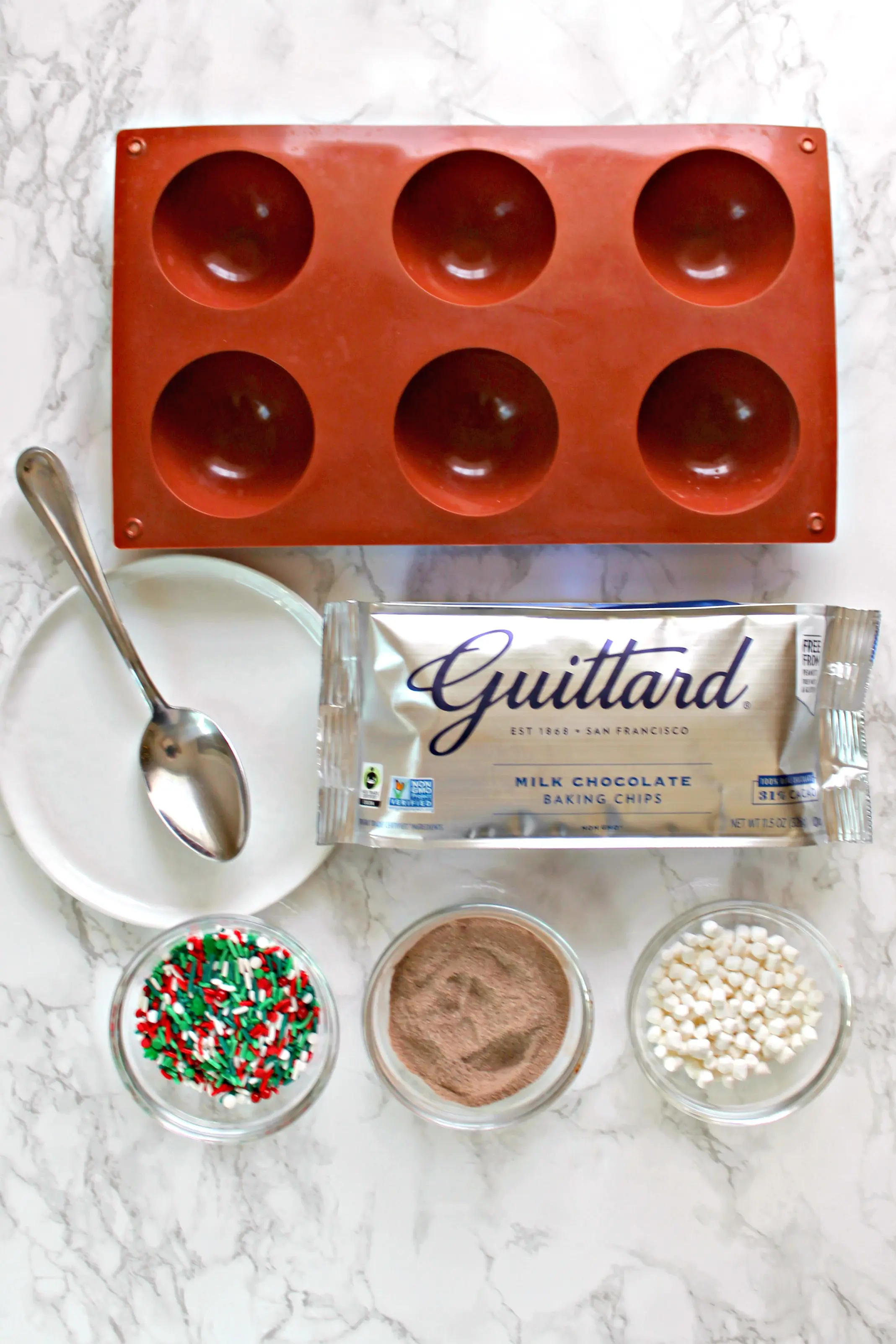 Overhead shot of ingredients for hot chocolate bombs.