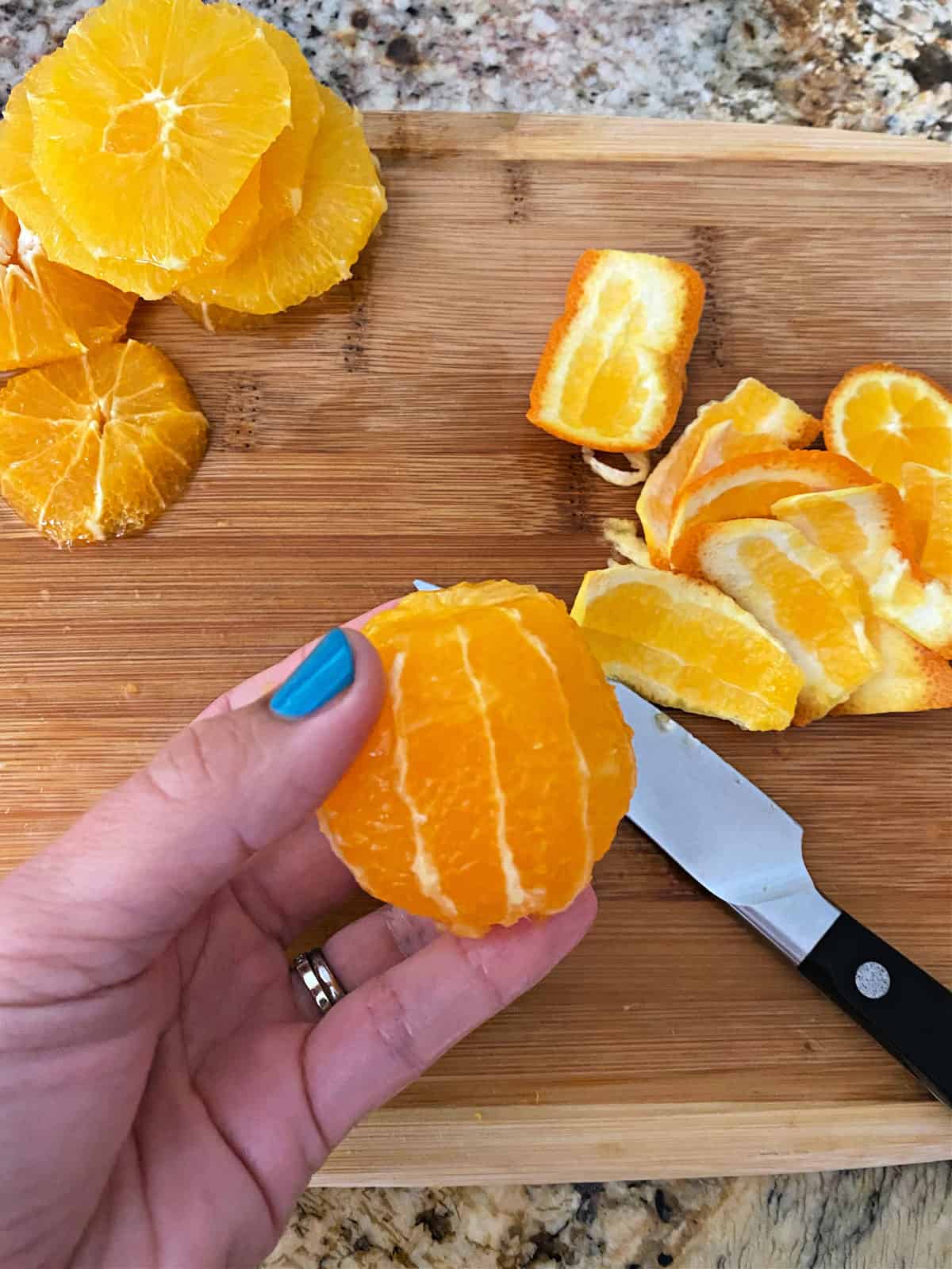 Process shot of finished product after removing skin from orange.