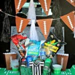 Car tailgate decorated with football decor for Super Bowl.