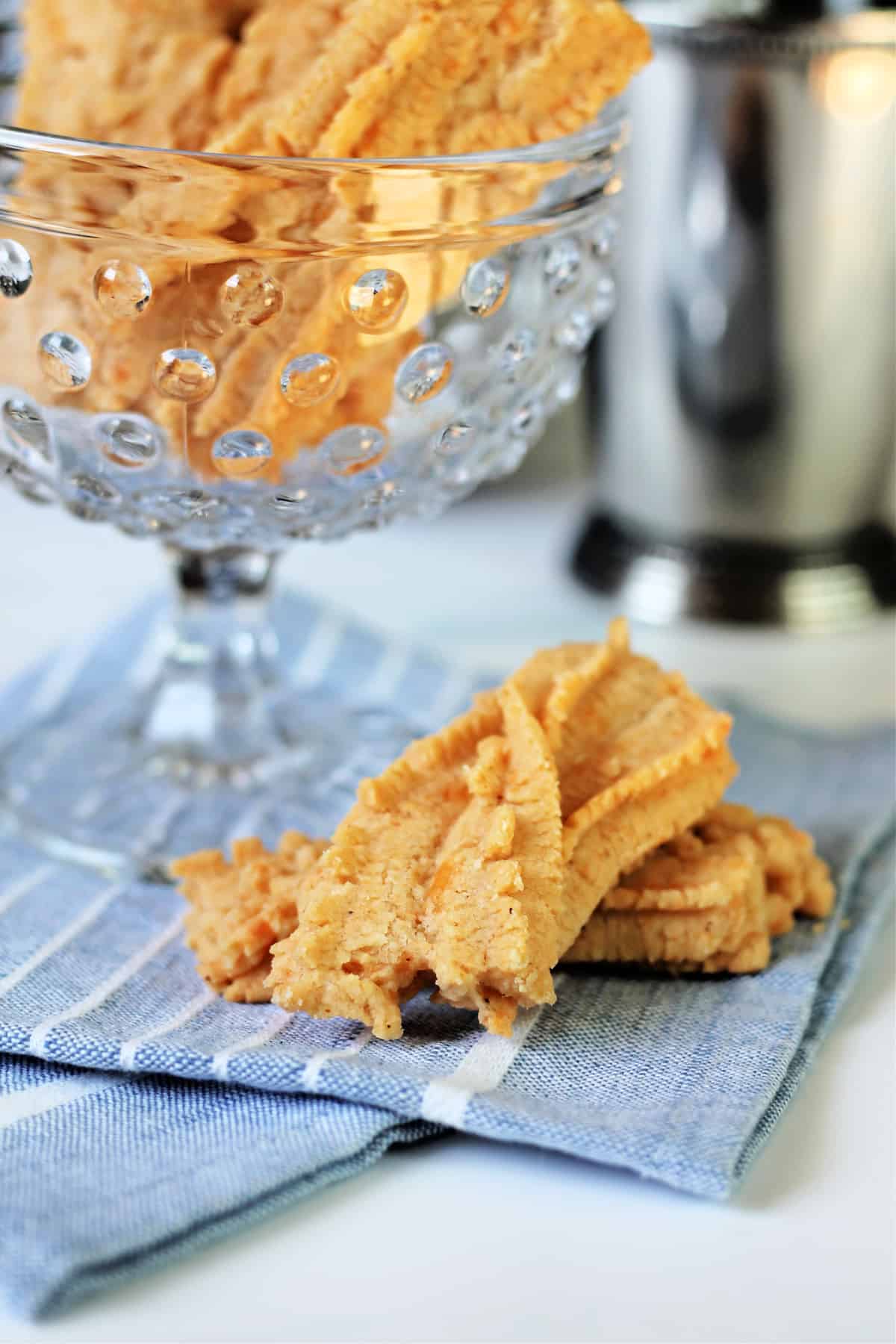 Southern Cheese Straws on a blue linen napkin.