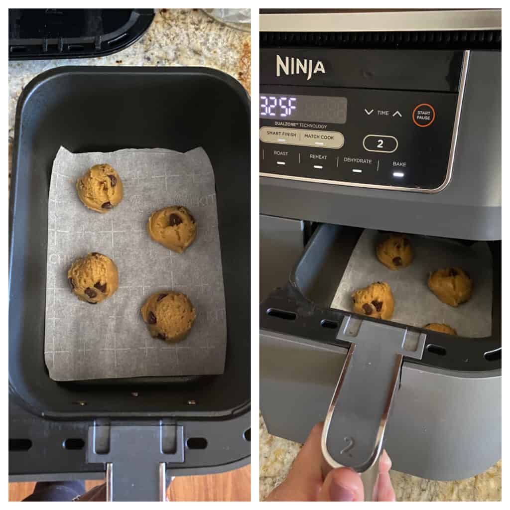 Cookie dough balls placed in the basket of the air fryer on a sheet of parchment paper.