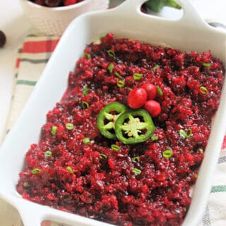 A white serving dish of Cranberry Jalapeno Dip