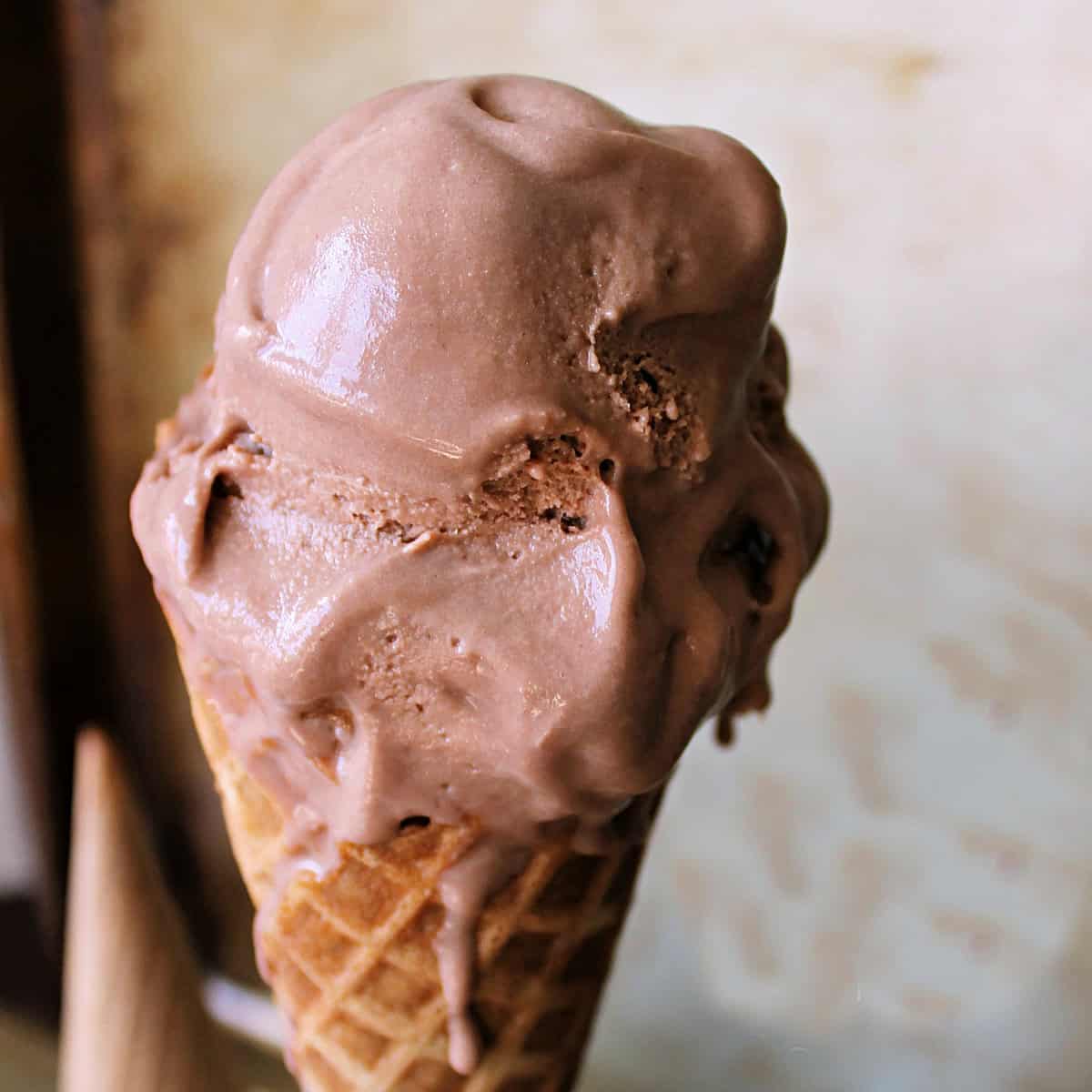A scoop of Nutella Ice Cream in a cone.