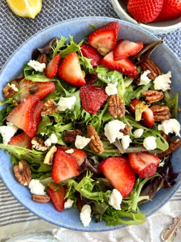 Strawberry & Goat Cheese Salad in a blue bowl.