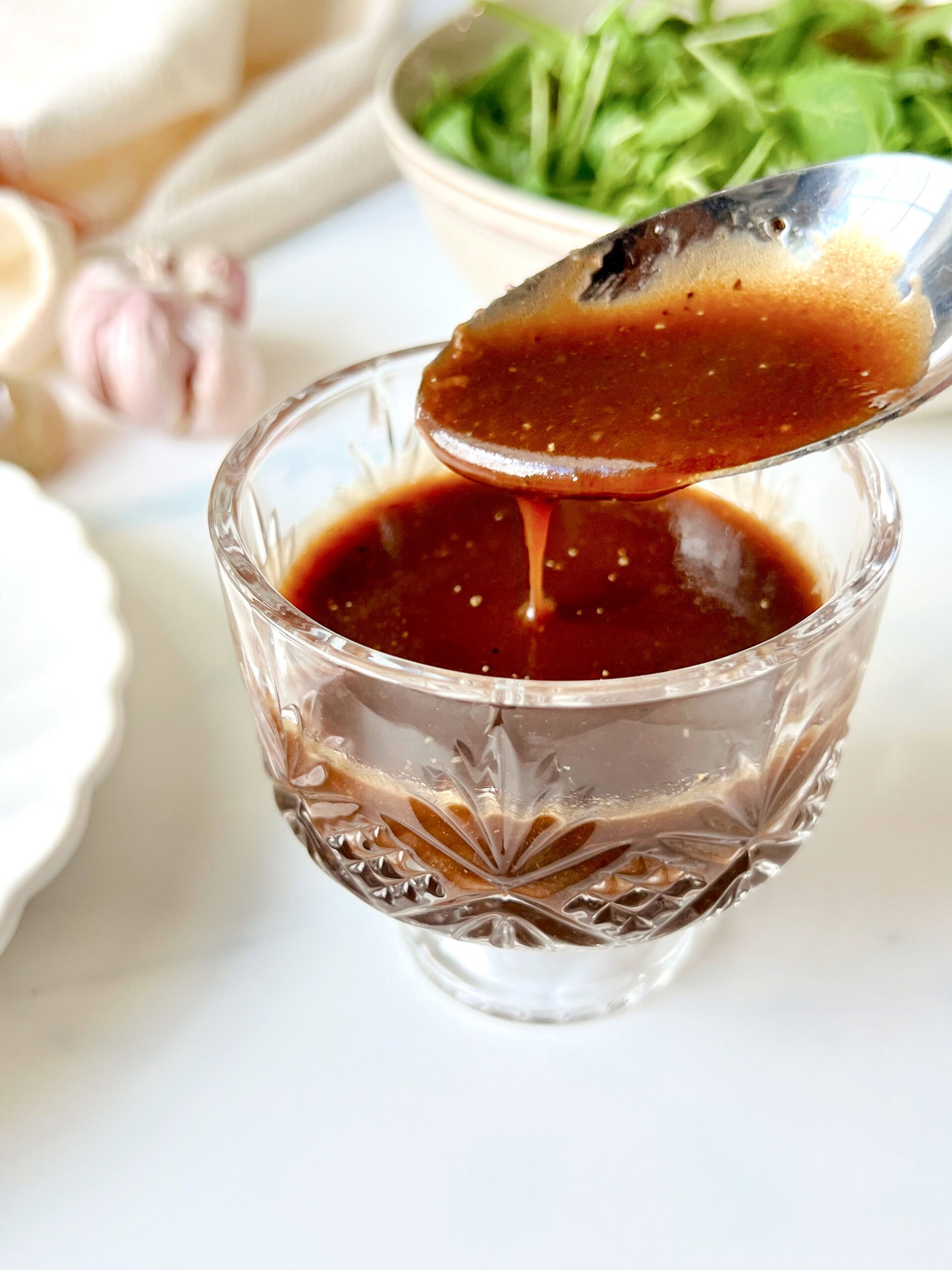 Balsamic Vinaigrette being spooned to show texture.