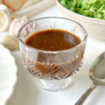 Balsamic vinaigrette in a small glass dish.