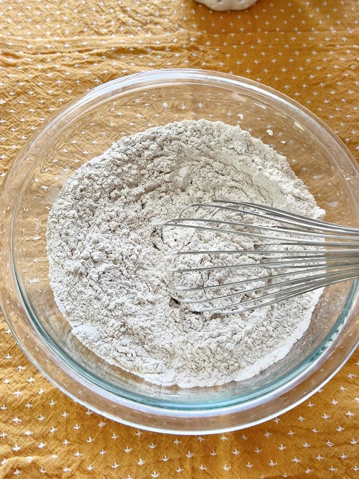 Dry ingredients in a bowl for Pumpkin Banana Bread.