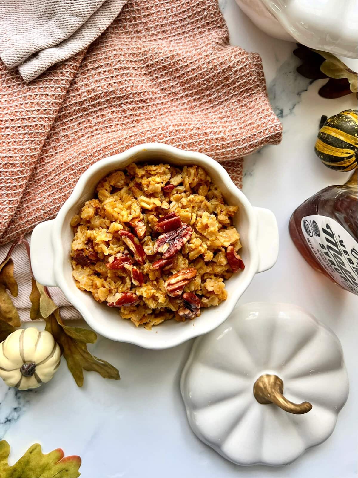 An overhead shot of Baked Pumpkin Oatmeal in a pumpkin shaped dish.