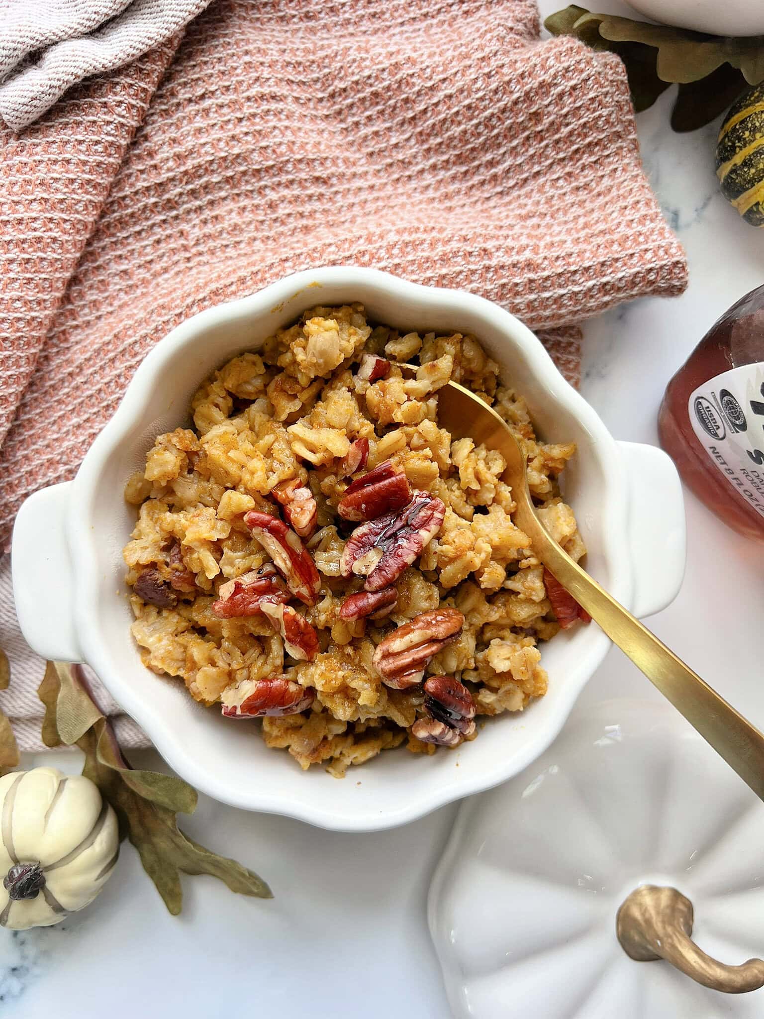 Baked Pumpkin Oatmeal in a white pumpkin shaped dish.